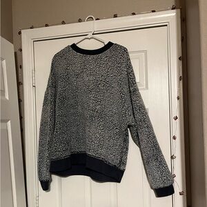 Soft and fluffy sweater with a light and dark gray coloring